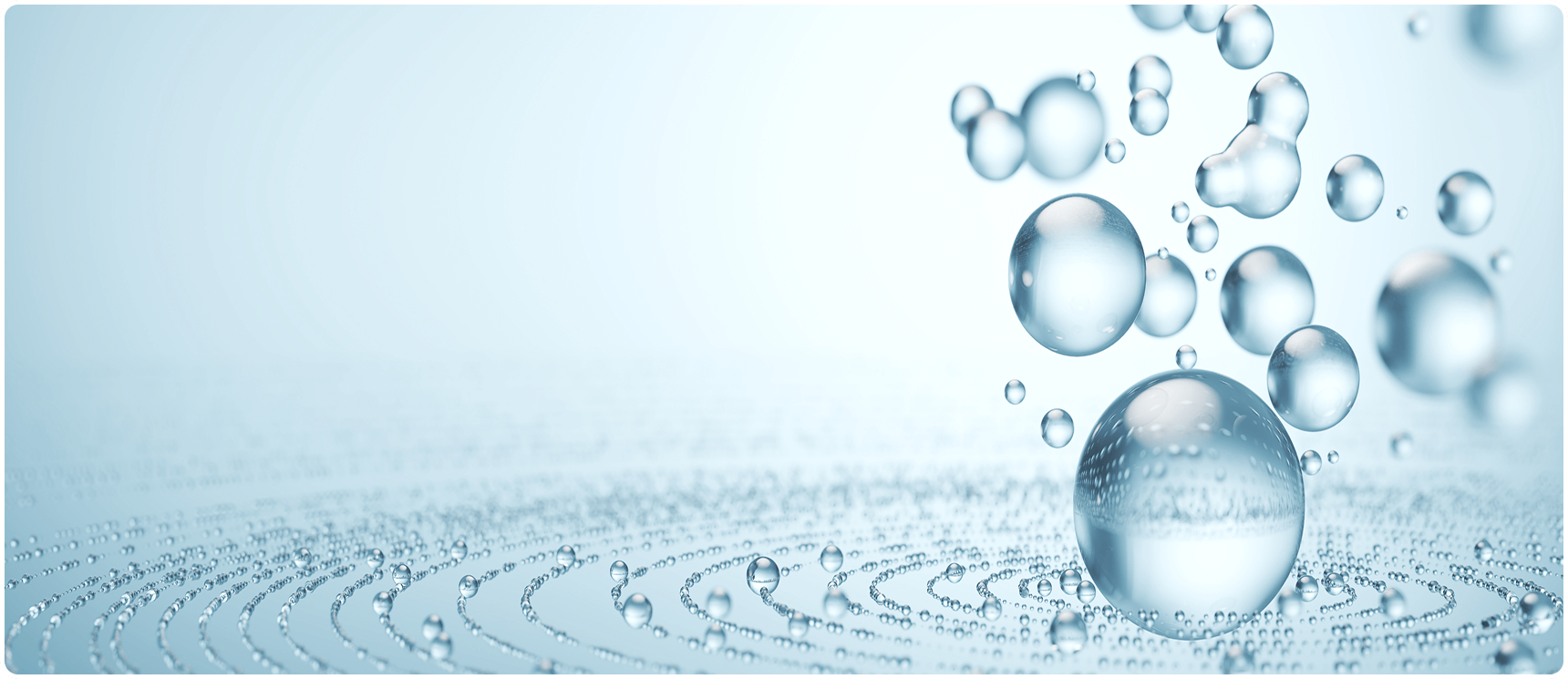 Transparent bubbles floating on rippled surface.